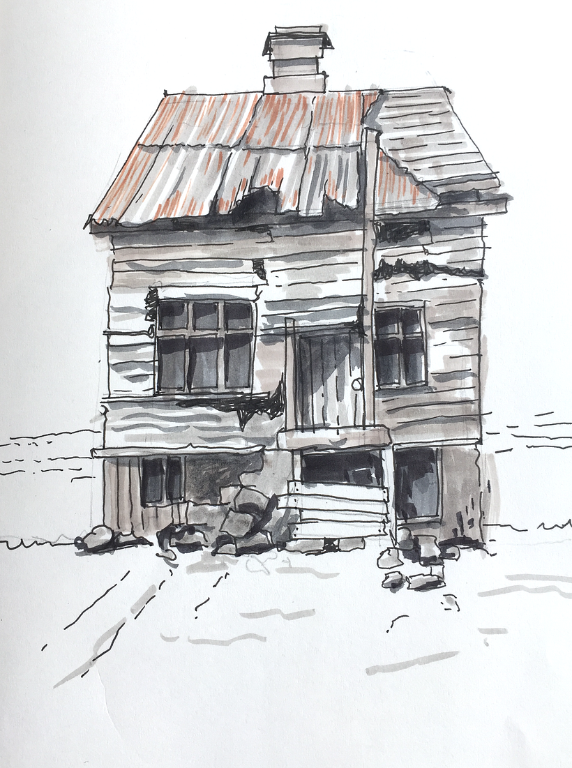 weathered abandoned house by the sea.