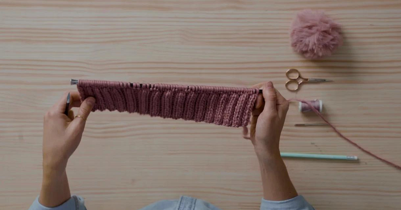 Work 11 rows of 2x2 rib stitches to begin creating the body of the hat.