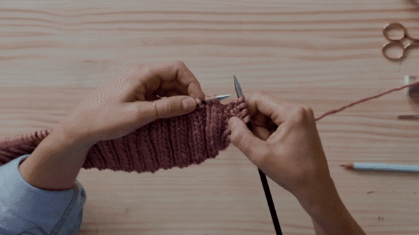 Cast on the first two stitches on a pencil, wind your yarn, put them back on your needle and knit the stitch.