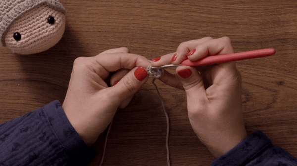 Perform an increase round and another base round to achieve the conical shape.