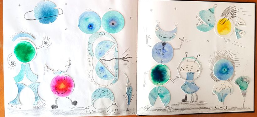 I used a circle cutter to recycle paper textured with water colour to create these "monsters" :)