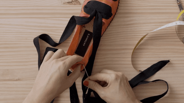 Remove the ribbons from the back ends of the espadrille.