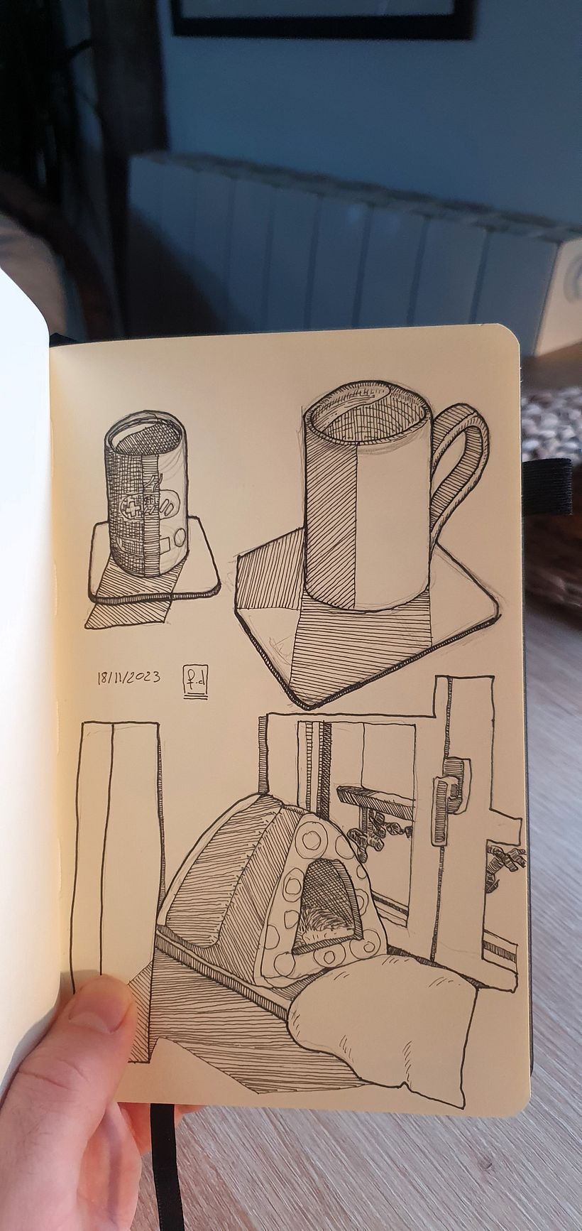 Cups of coffee and a cat's hut by the windowsill