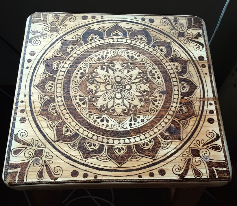 I burn my mandala unto a old pine chair of mine.