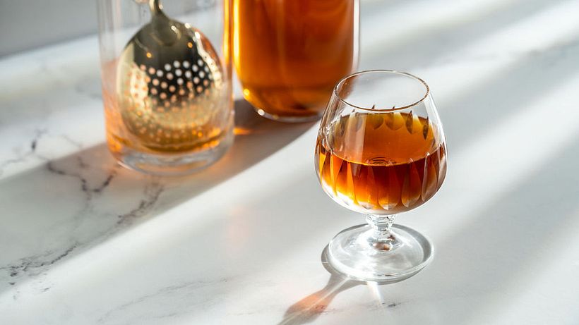 A Sazerac cocktail shot in-studio using off-camera flash. Focussed on simple backdrops and contrast lighting.