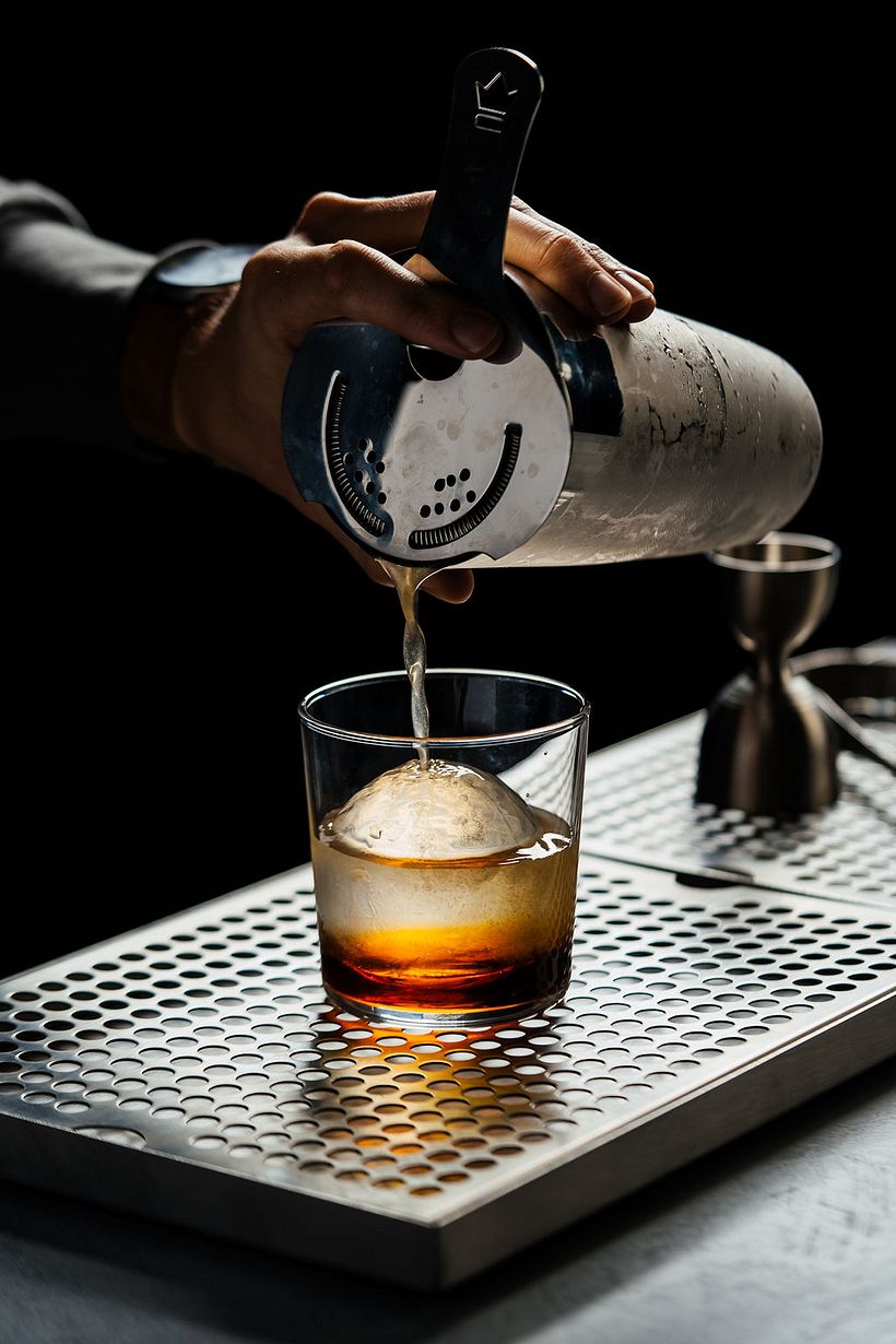 Dark and moody cocktail shot in-studio