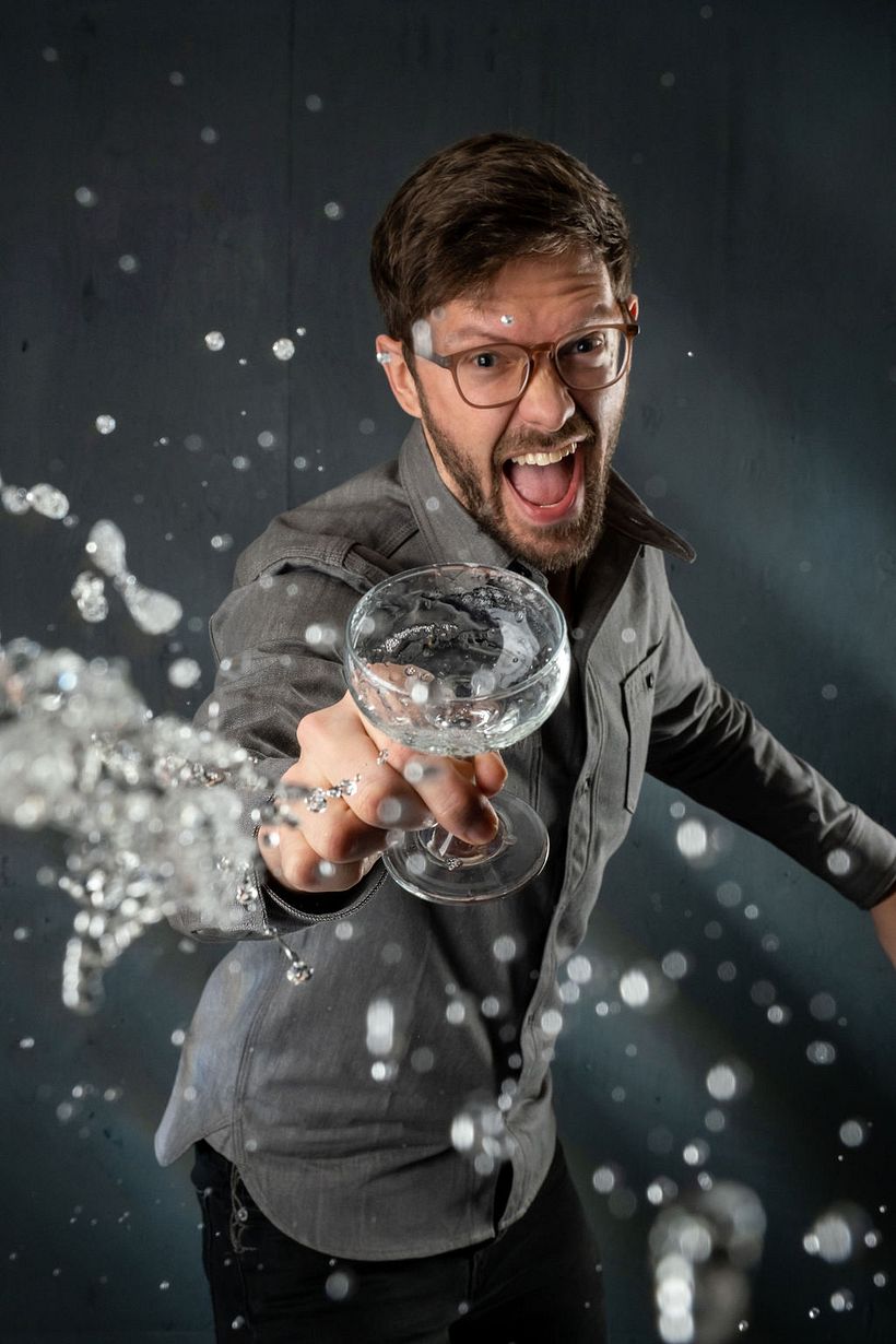 Self-portrait using a shutter remote and plexiglass to shield my camera from getting drenched!
