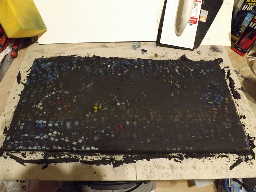 Mosaic been cutted, reversed and glued with cement tiles glue, after 24h filled with black color grout