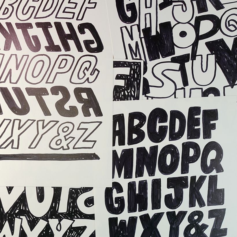 Many drawings scattered over the desk!