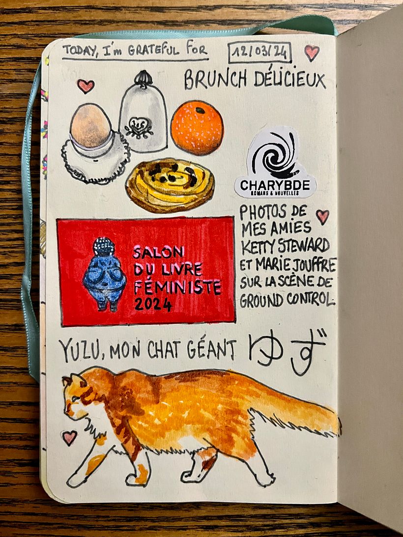 Soft boiled eggs in nice holders, juicy orange, raisin pastry. Friends debating on stage at the Feminist Book Convention.