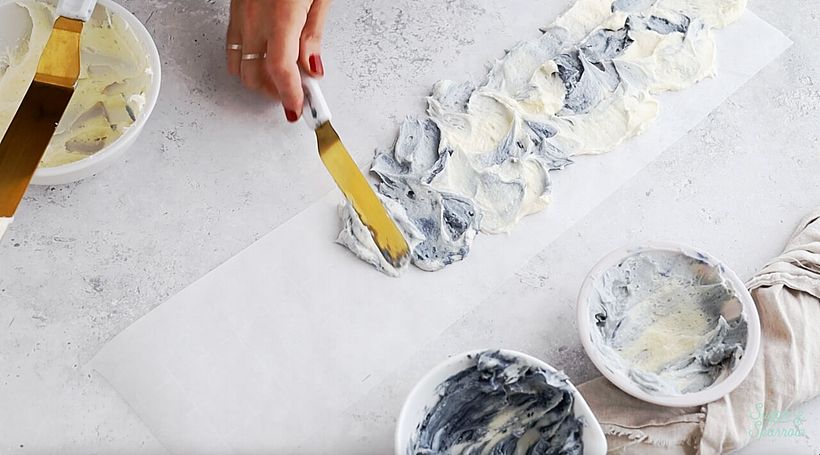 marbling the buttercream on a strip of parchment paper