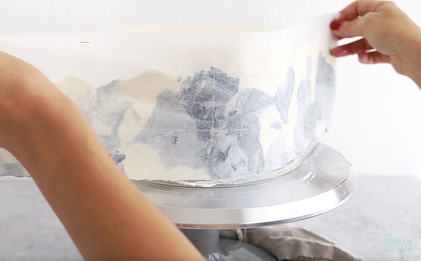 wrapping the parchment paper around the cake