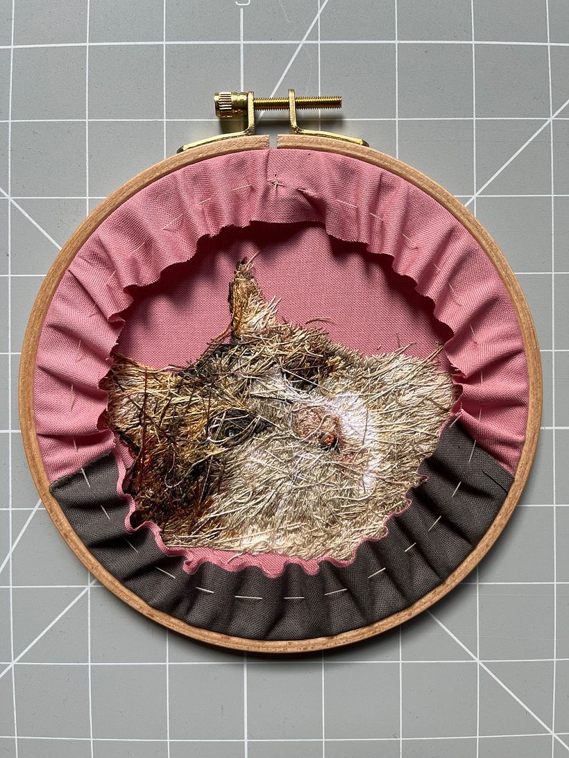 Back side of the finished embroidery before covering with fabric