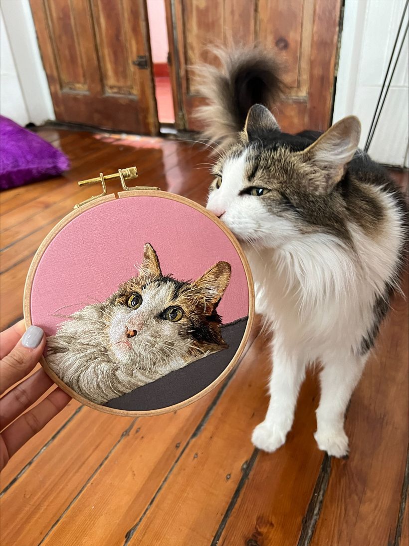 Carlitos smelling his portrait