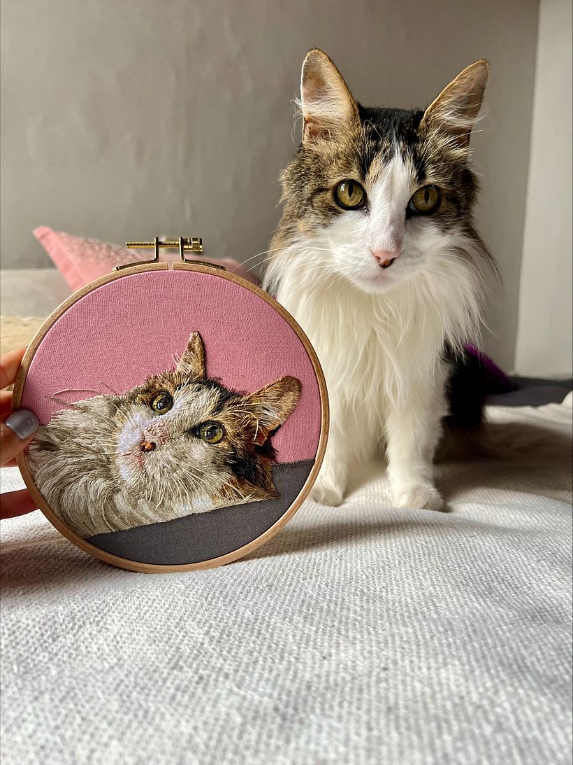 Carlitos with his portrait