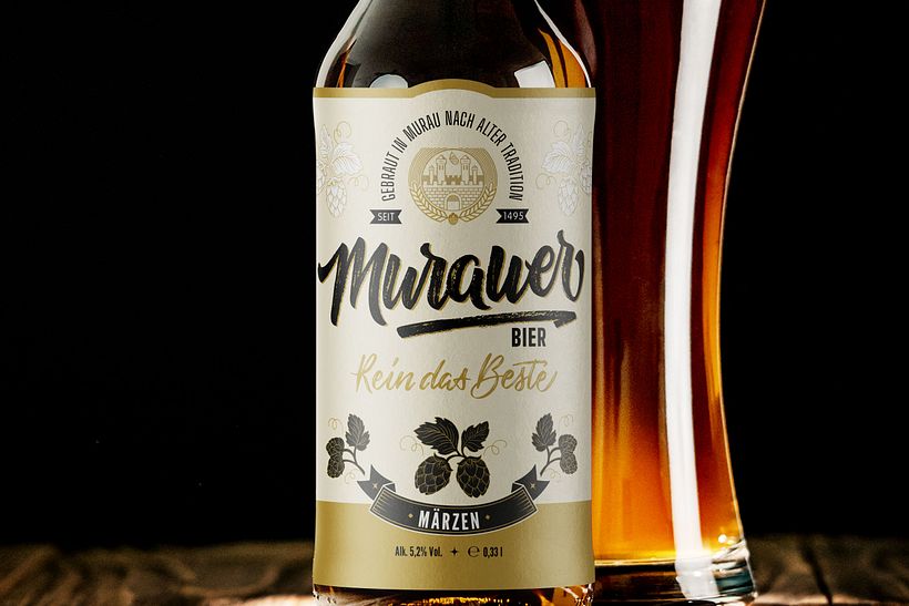 Logo design based on brush calligraphy with rough texture as main part of a beer label