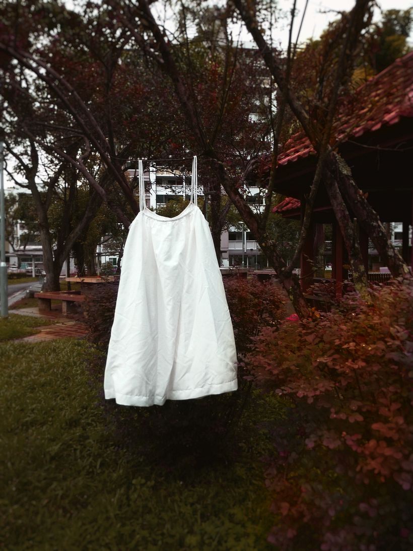 𝙷 𝙴 𝚁__ Dress.  A white dress hung up in solitary.