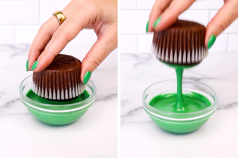 Dipping the dome of the cupcake into melted green chocolate