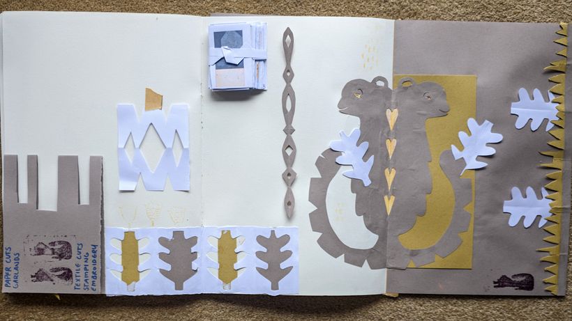 Practicing paper-cutting techniques.