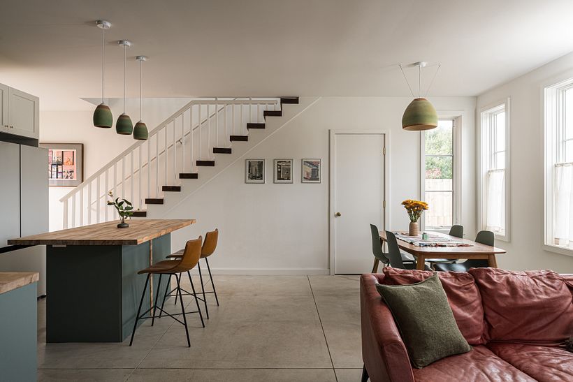 View of the installed pendant lights, 3 left over the kitchen island, 1 large one over the dining table.
