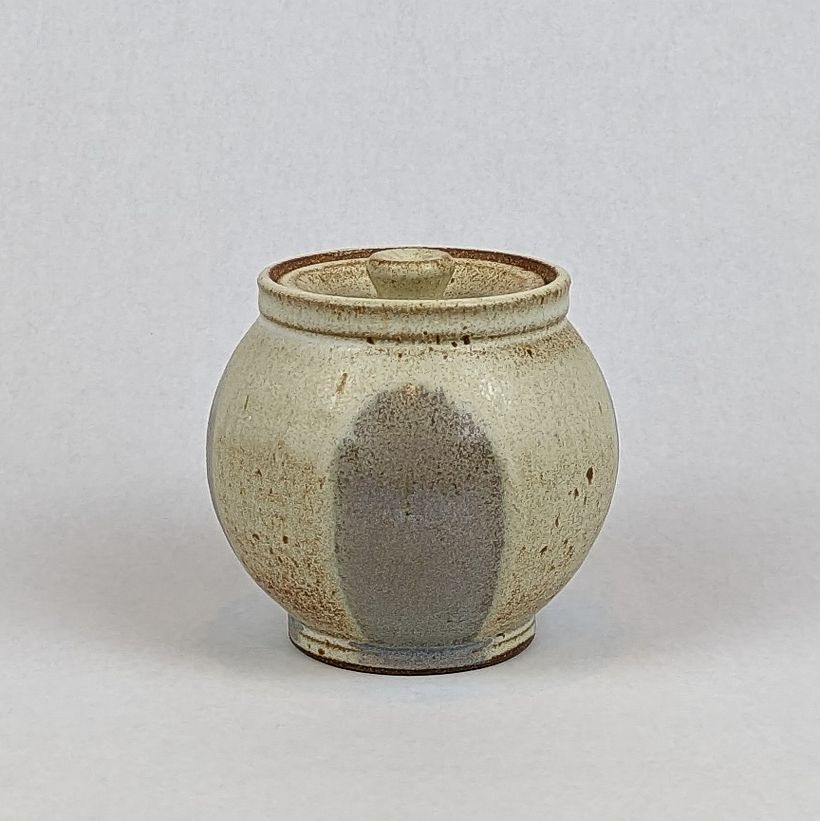 Lidded jar with "pink hills" glaze decoration.