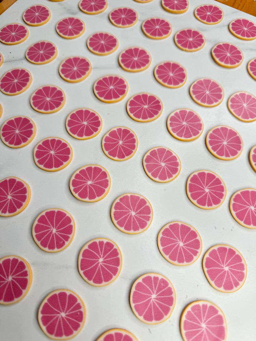 I made a clay cane for the grapefruit and sliced it out before adding detail and baking.