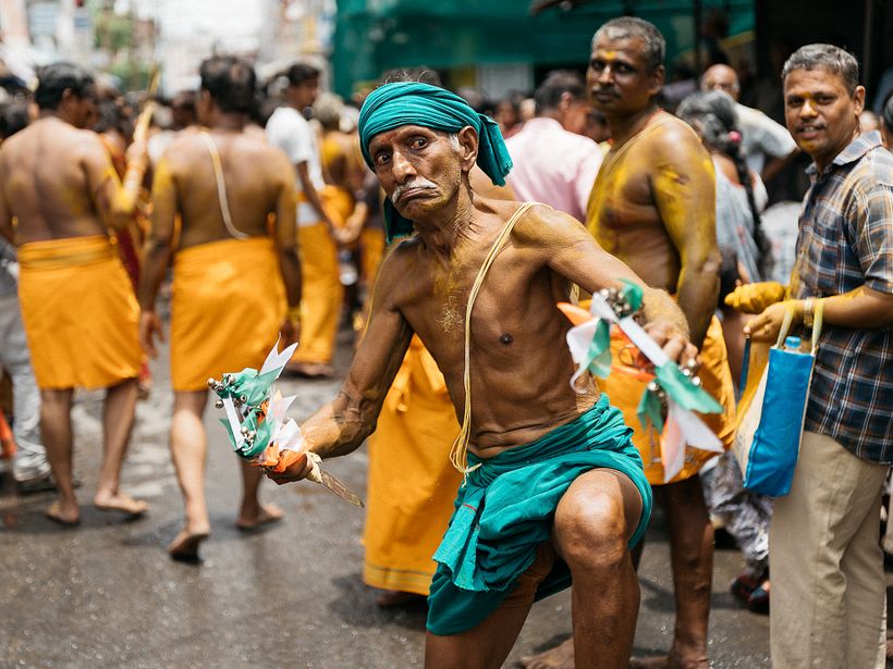 An old man in fierce kathi ritual.