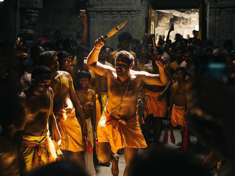 The kathi performance for the day started in an ancient Shiva temple with sunlight coming from the top.