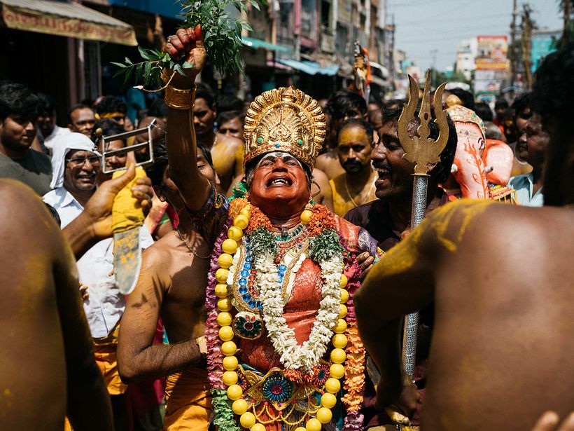 A man in the disguise of godess Shakthi in trance