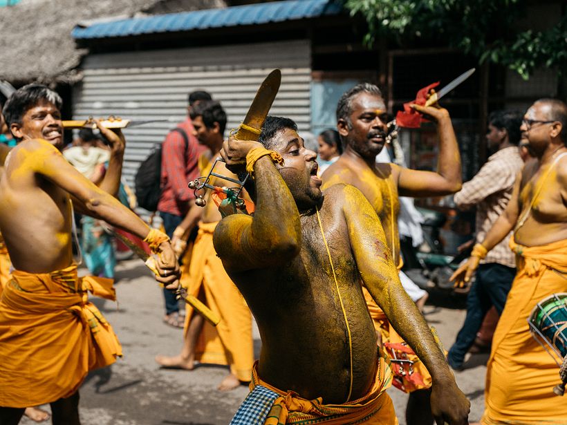 An young lad hurts himself with kathi (Sword) to invoke the godess.