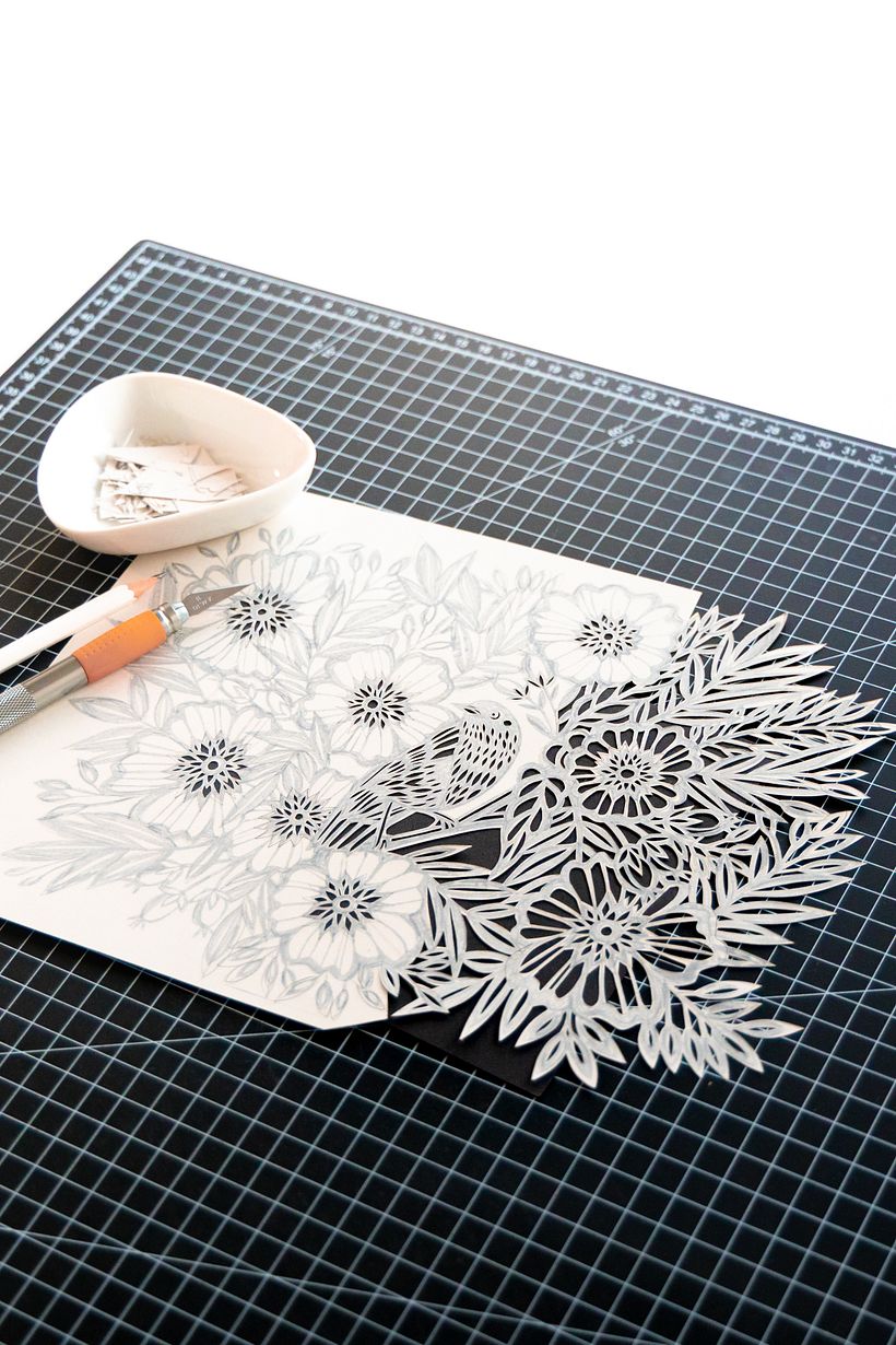 Bird Among the Flowers: A Detailed Papercut Illustration 1