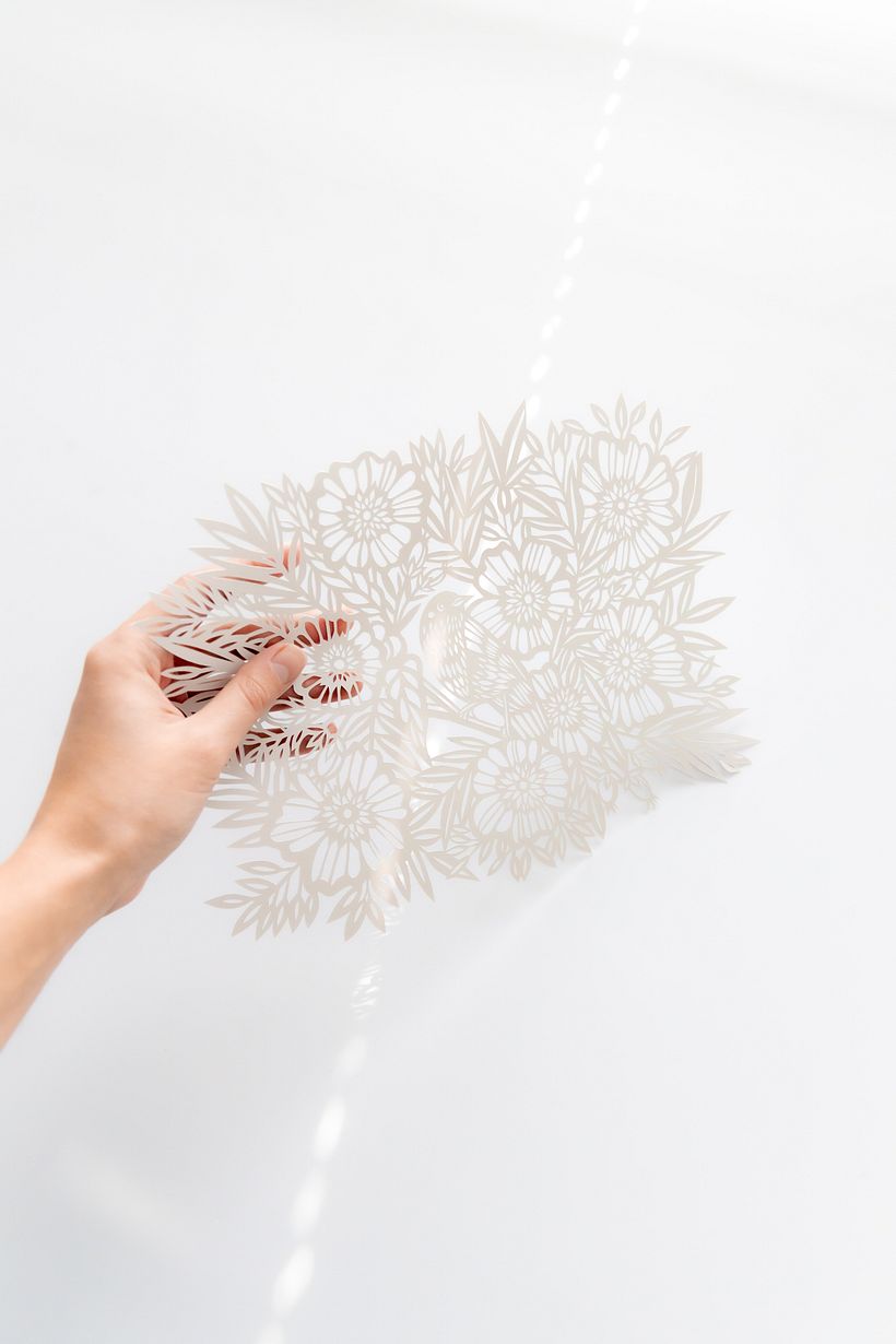 Bird Among the Flowers: A Detailed Papercut Illustration 1