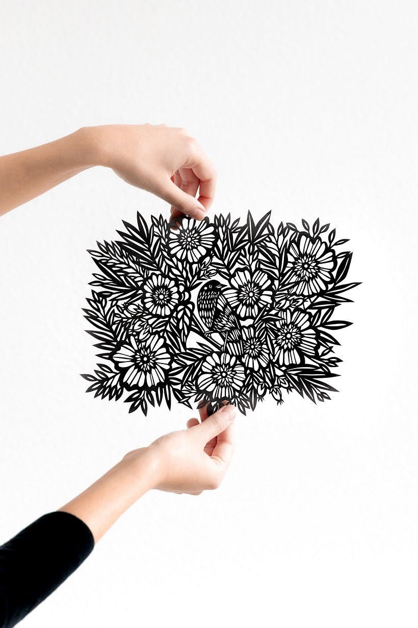 Bird Among the Flowers: A Detailed Papercut Illustration 1
