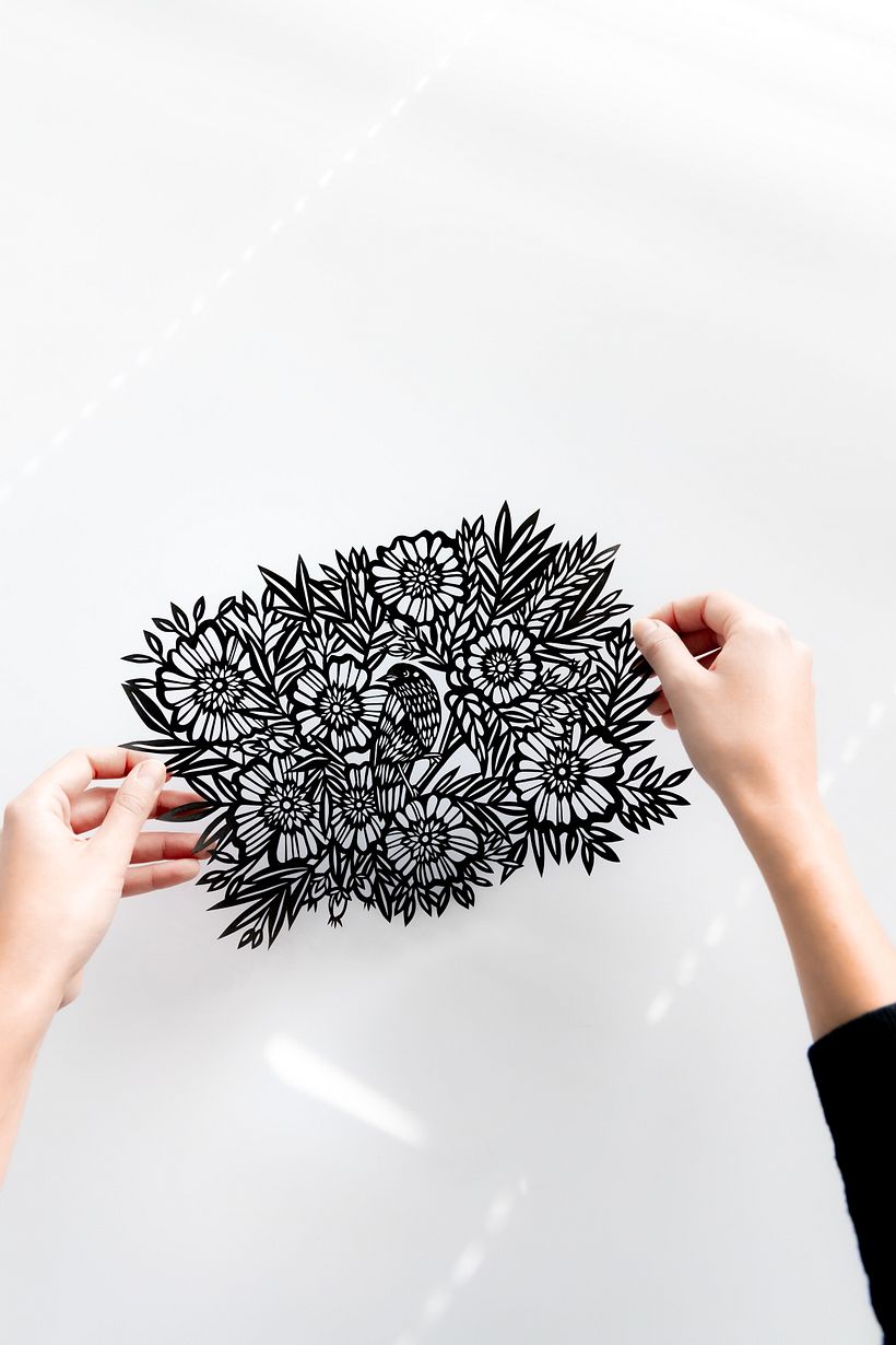 Bird Among the Flowers: A Detailed Papercut Illustration 1